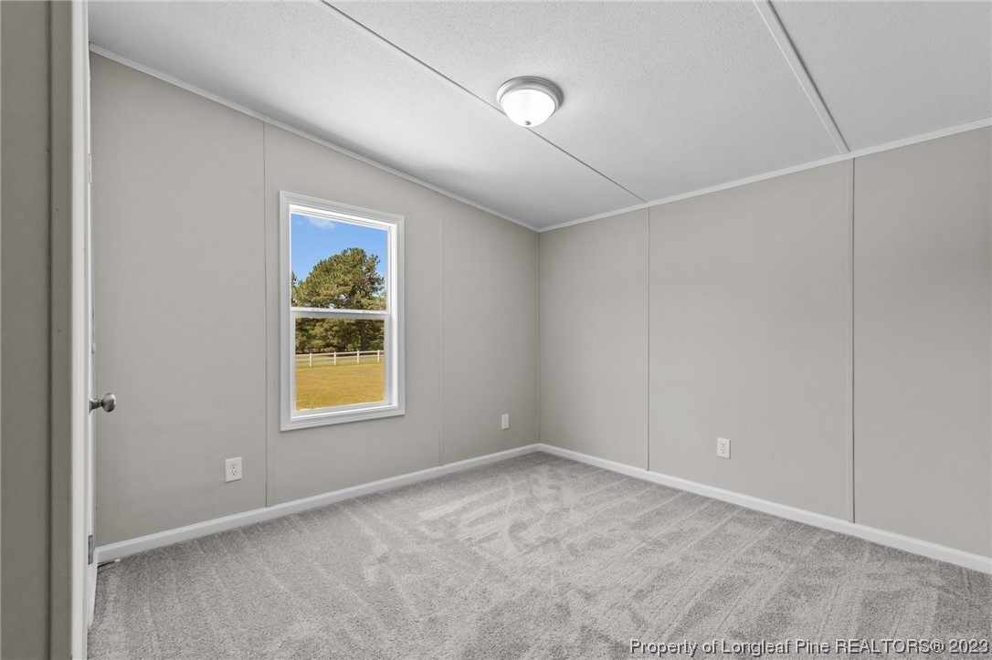 1770 Ashemont Road Aberdeen, NC 28315 - Photo 19 of 29 an empty room with windows