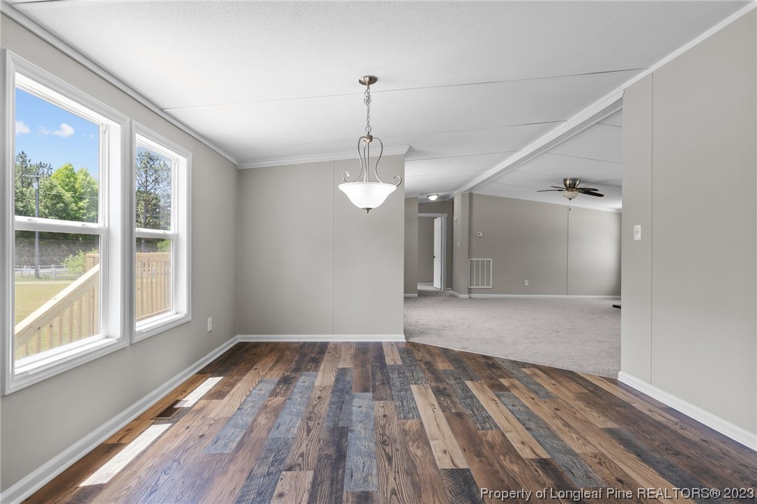 1770 Ashemont Road Aberdeen, NC 28315 - Photo 21 of 29 a view of empty room with wooden floor and fan