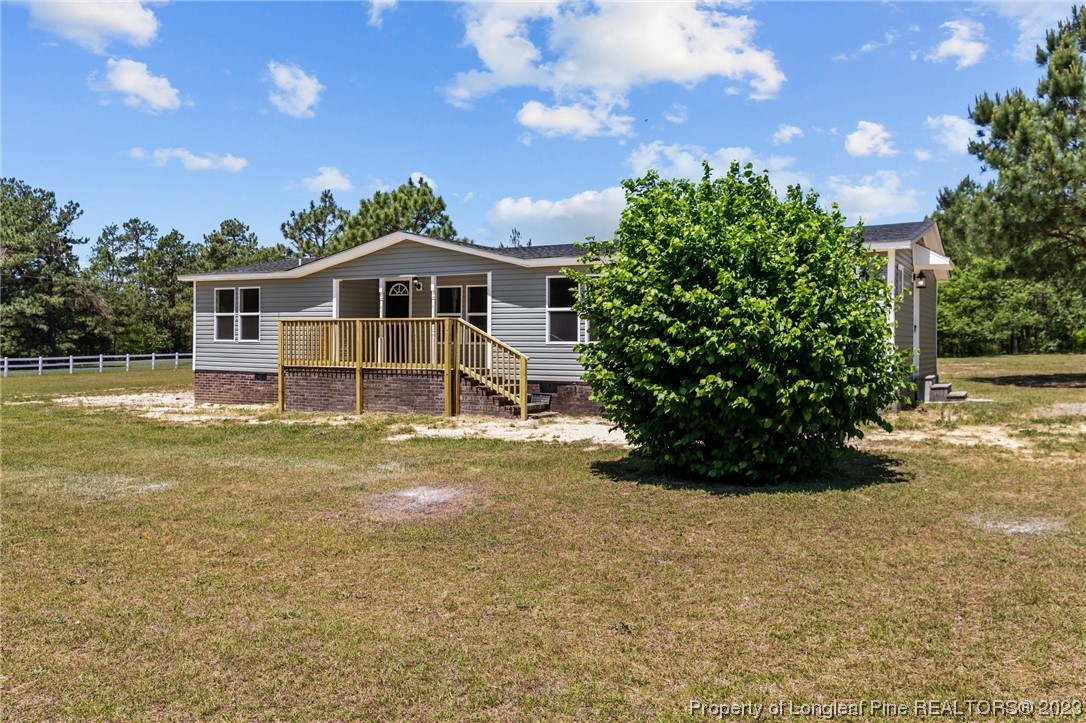 1770 Ashemont Road Aberdeen, NC 28315 - Photo 22 of 29 a front view of a house with a garden