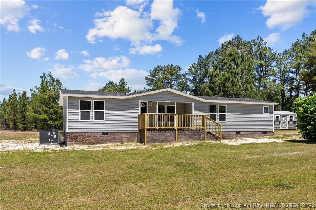 1770 Ashemont Road Aberdeen, NC 28315 - Photo 23 of 29 a house view with a garden space