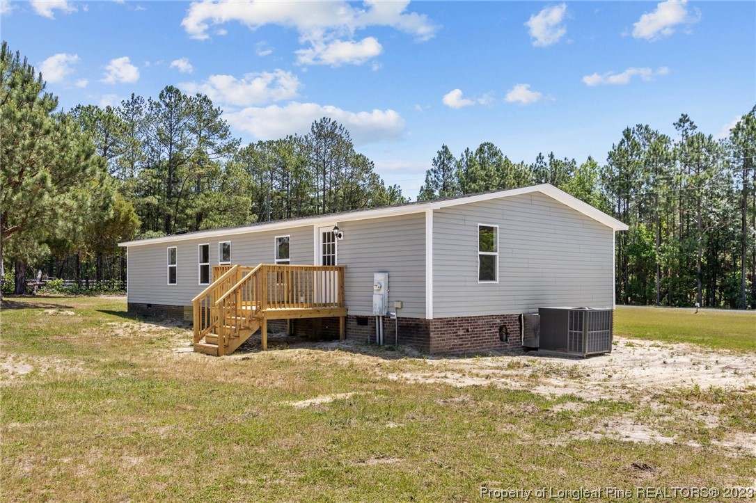 1770 Ashemont Road Aberdeen, NC 28315 - Photo 26 of 29 a view of a house with a yard and sitting area