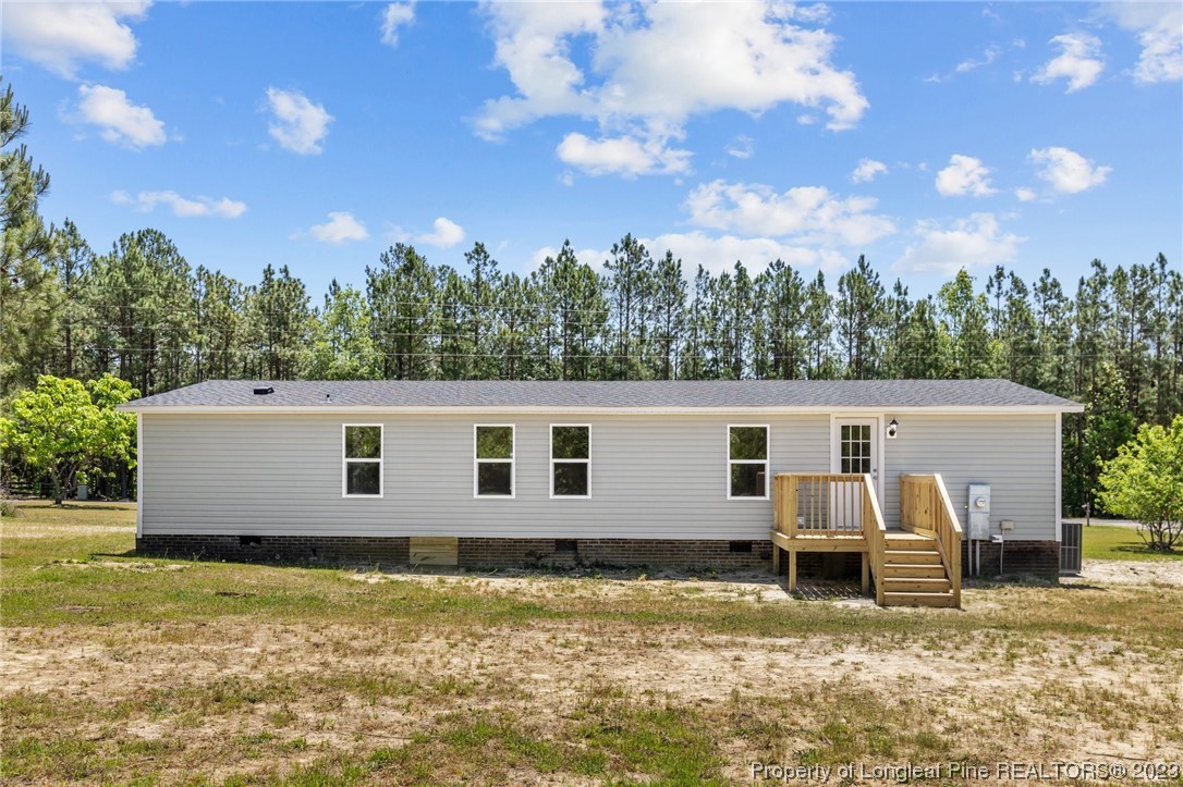 1770 Ashemont Road Aberdeen, NC 28315 - Photo 27 of 29 a view of a white house with a yard