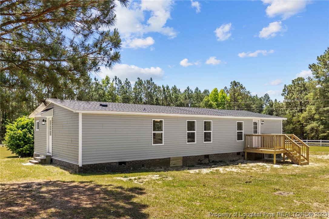 1770 Ashemont Road Aberdeen, NC 28315 - Photo 28 of 29 a view of a house with a yard