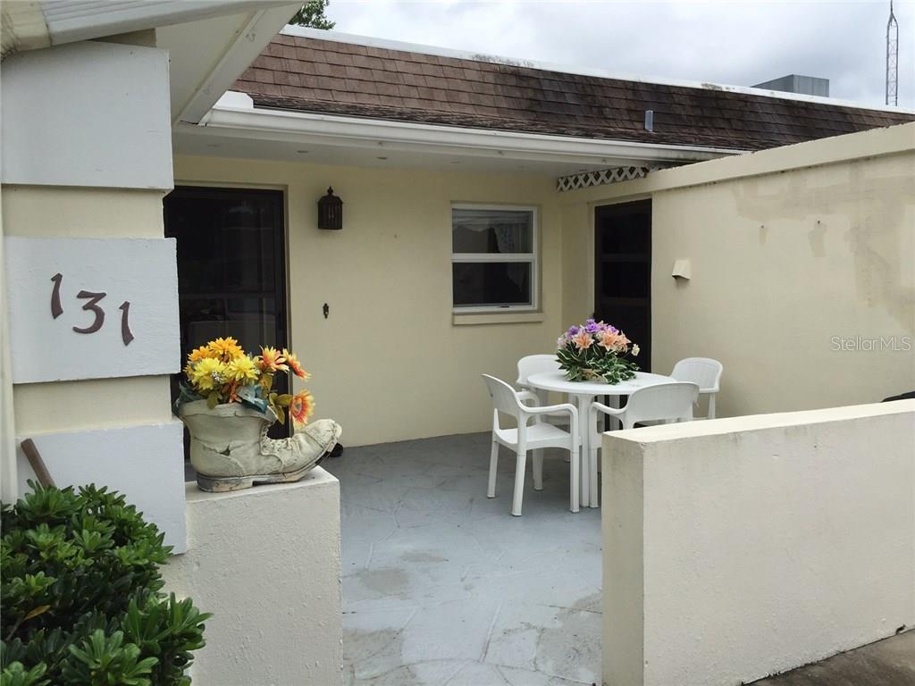 610 Indian Rocks Road North, Unit 131 Belleair Bluffs, FL 33770 - Photo 1 of 1 Private courtyard/patio to front door