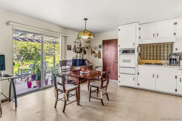 a view of a dining room with furniture window and outside view