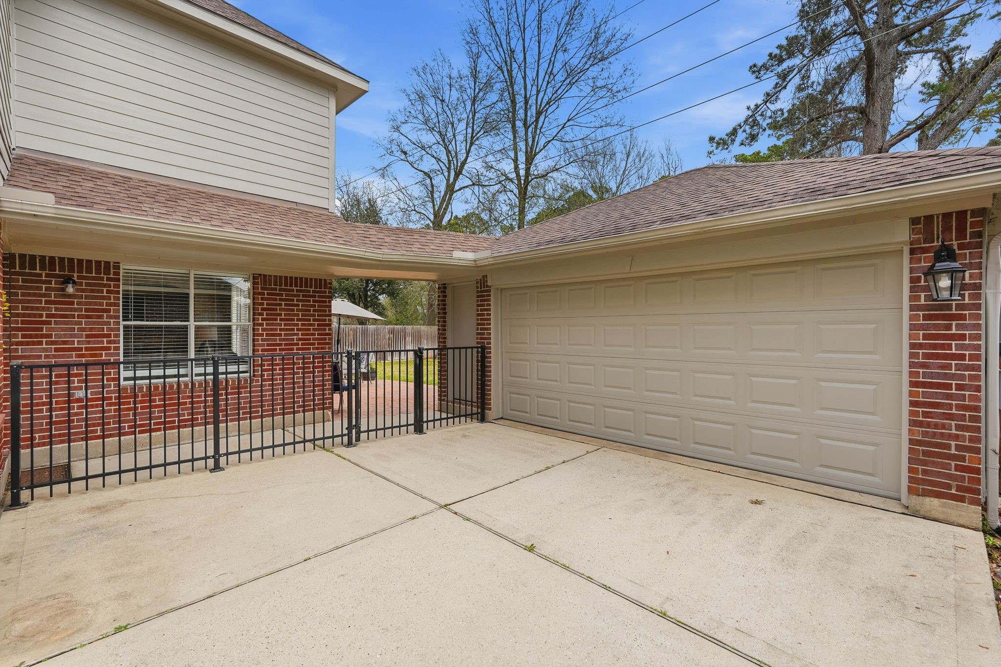 2515 Woodsboro Drive Spring, TX 77388 - Photo 38 of 44 This charming two-story home with brick exterior and a spacious two-car garage. Enjoy a cozy patio area perfect for outdoor relaxation.