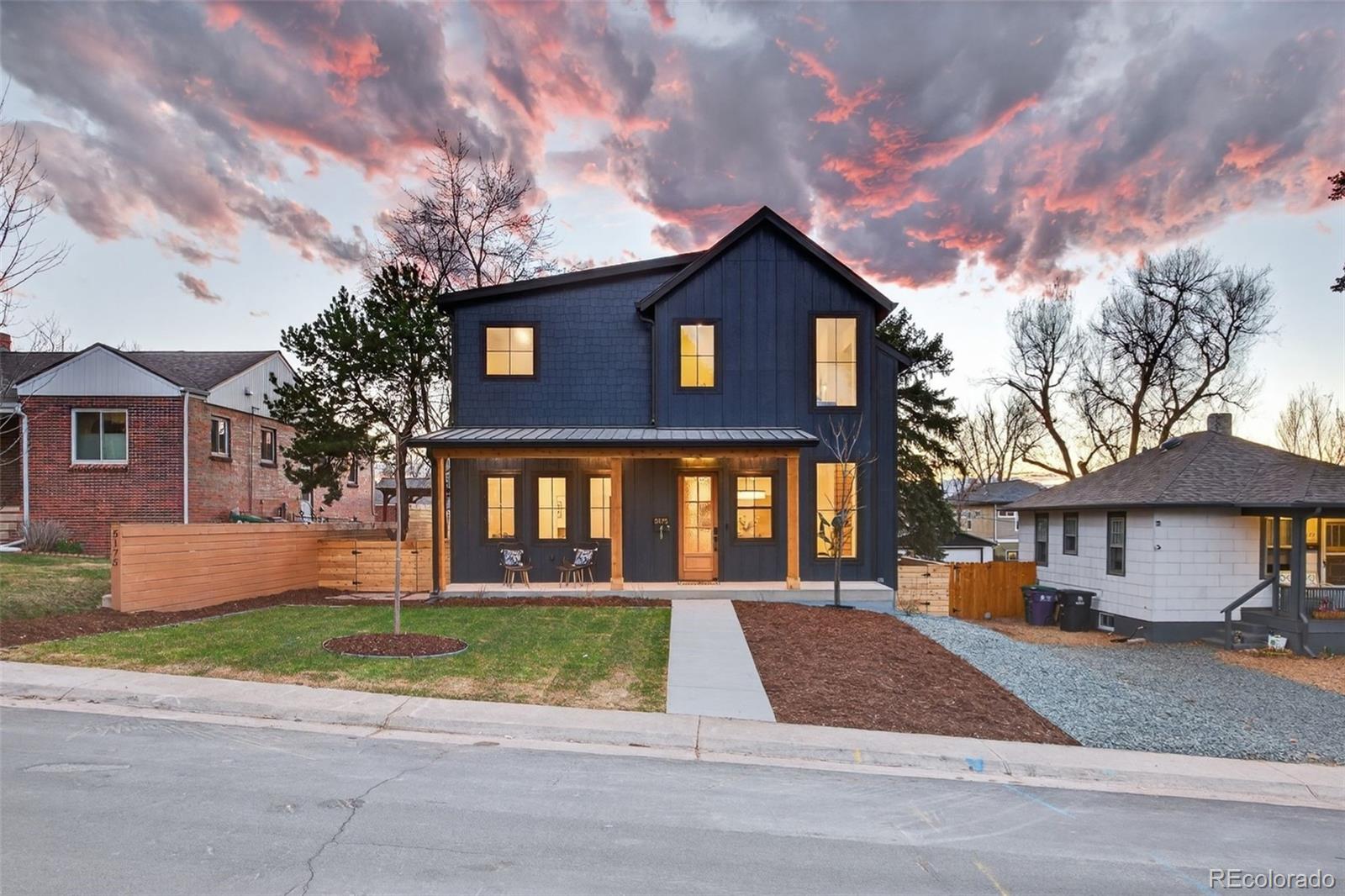5175 Raleigh Street Denver, CO 80212 - Photo 10 of 49 a front view of a house with a yard and garage