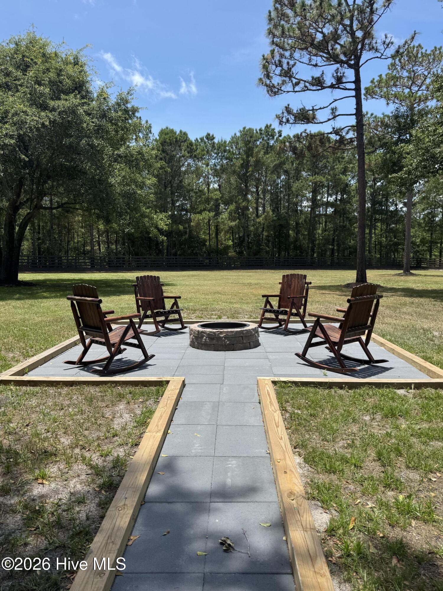 1265 Gilbert Road Southeast Bolivia, NC 28422 - Photo 6 of 46 Enjoy cool summer nights and the coming fall afternoons around the fire pit