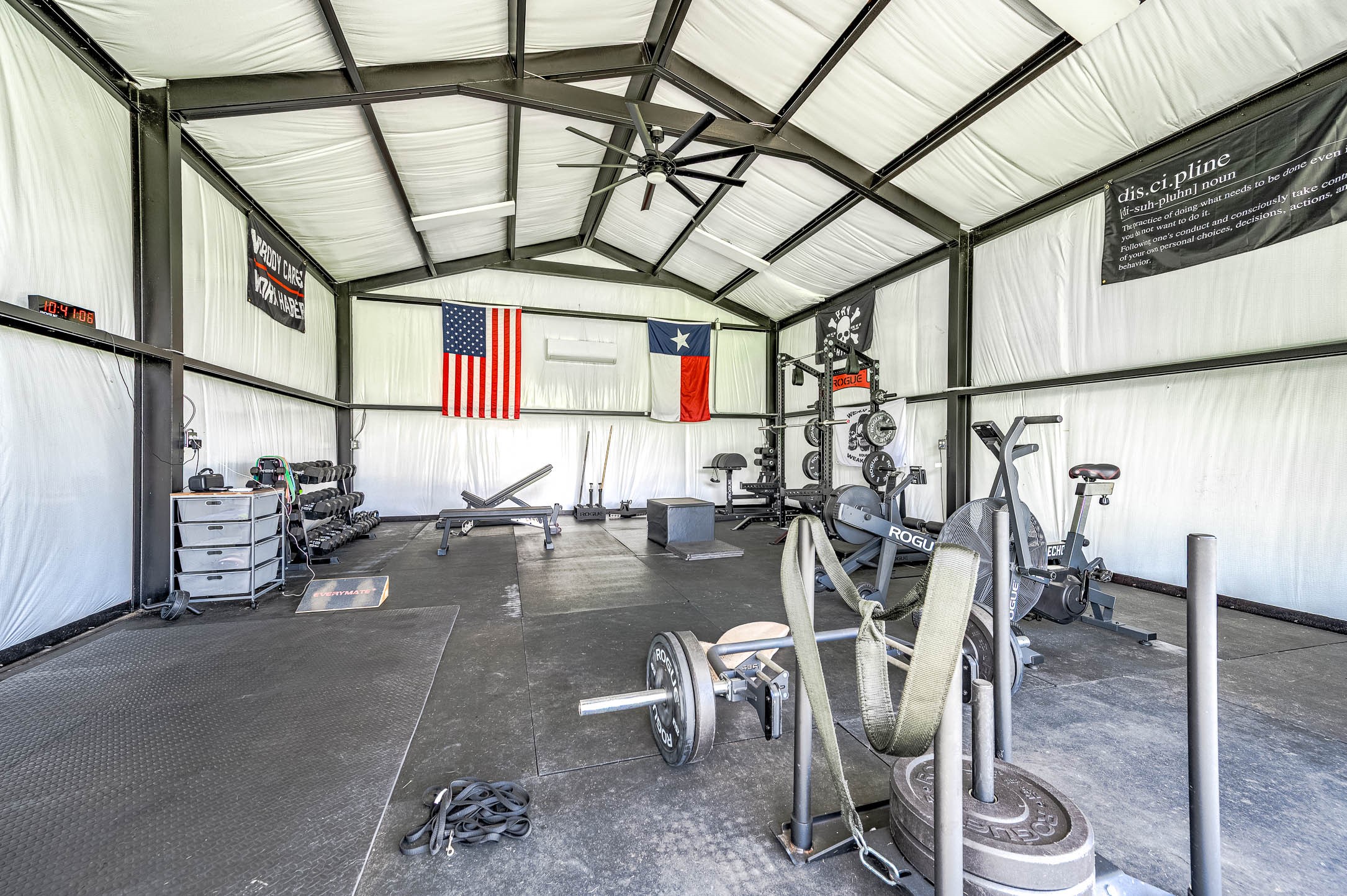 8032 Short Road Needville, TX 77461 - Photo 35 of 50 Inside the barn-style building, you’ll find a spacious climate-controlled gym area with high ceilings and ample room for a variety of equipment and activities. This flexible space offers excellent potential for fitness, recreation, hobbies, or customized use to fit your lifestyle.