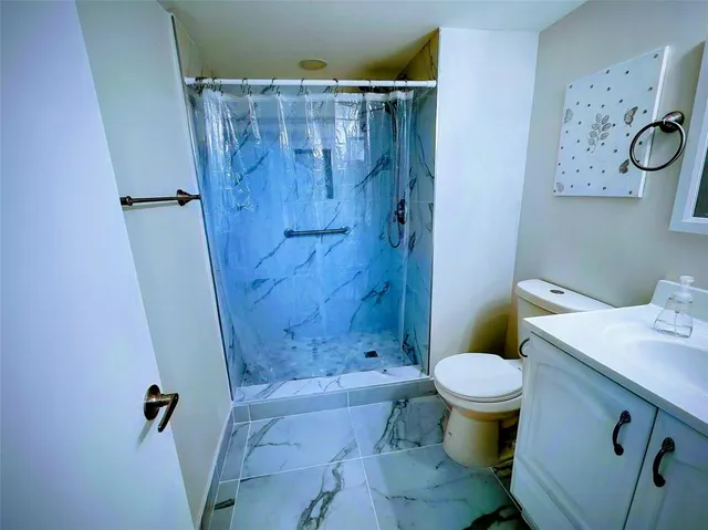 a bathroom with a sink and toilet