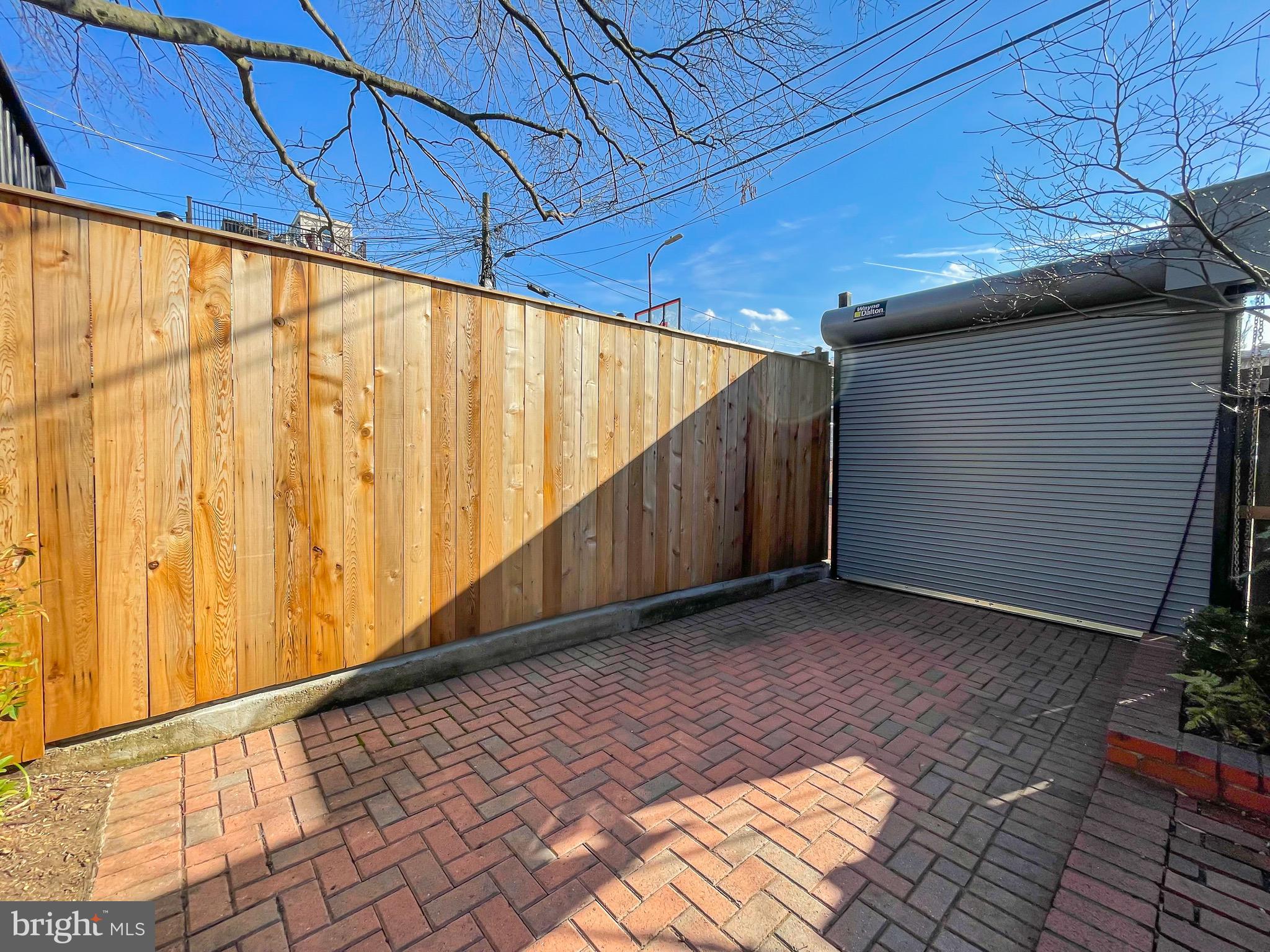 323 E Street Northeast Washington, DC 20002 - Photo 52 of 84 Parking space with roll-up garage door