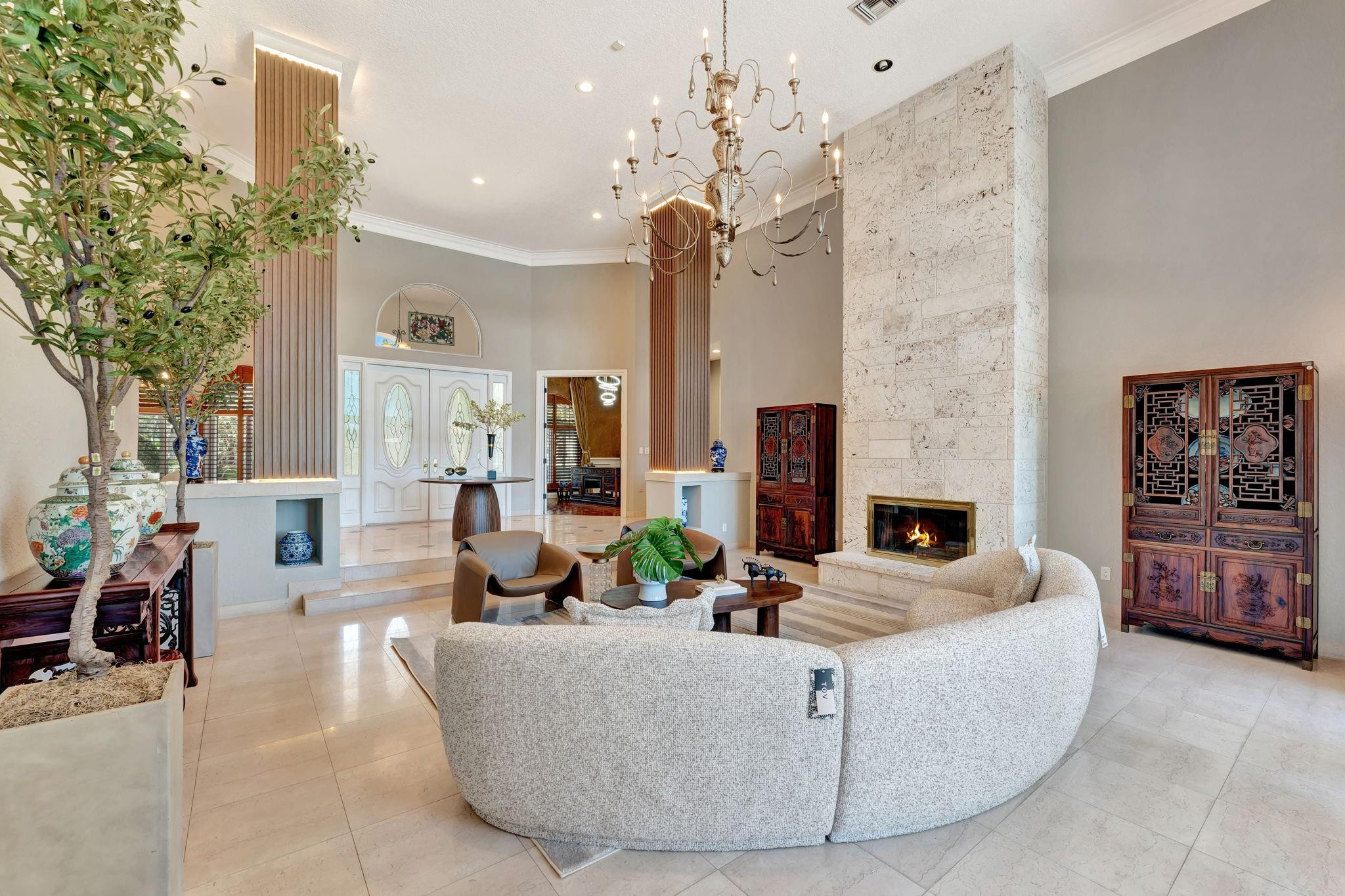 3460 Windmill Ranch Road Weston, FL 33331 - Photo 15 of 75 a living room with furniture a fireplace and a potted plant