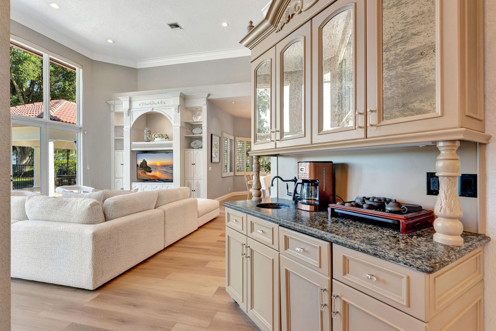 3460 Windmill Ranch Road Weston, FL 33331 - Photo 16 of 75 a kitchen with granite countertop a sink and a white cabinets
