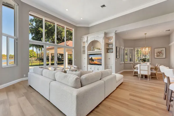 a kitchen with stainless steel appliances granite countertop a sink a stove and a refrigerator