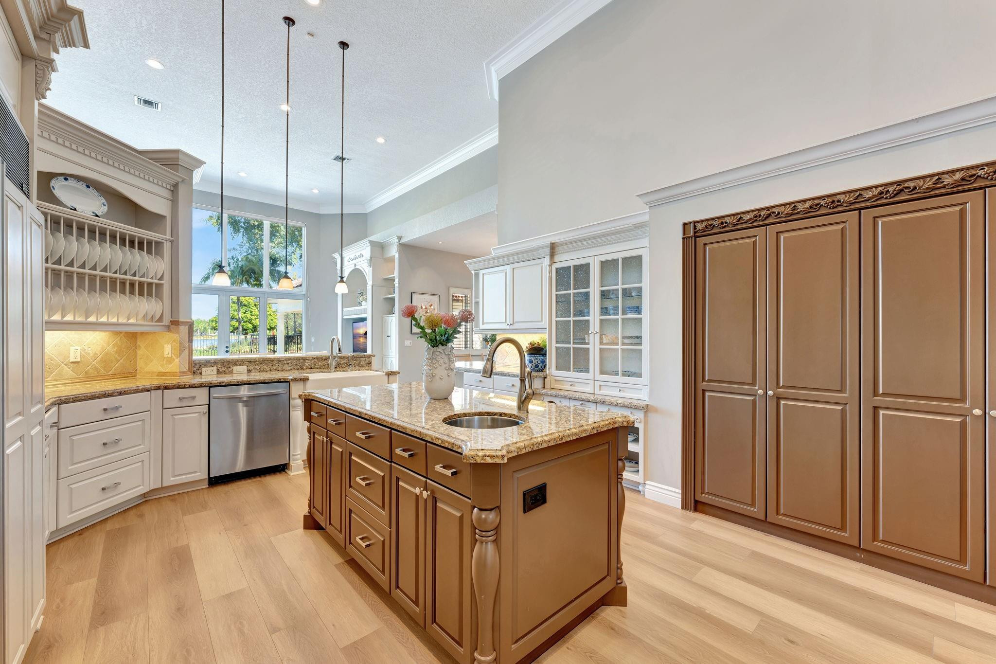 3460 Windmill Ranch Road Weston, FL 33331 - Photo 25 of 75 a kitchen with granite countertop a sink appliances counter top space and cabinets