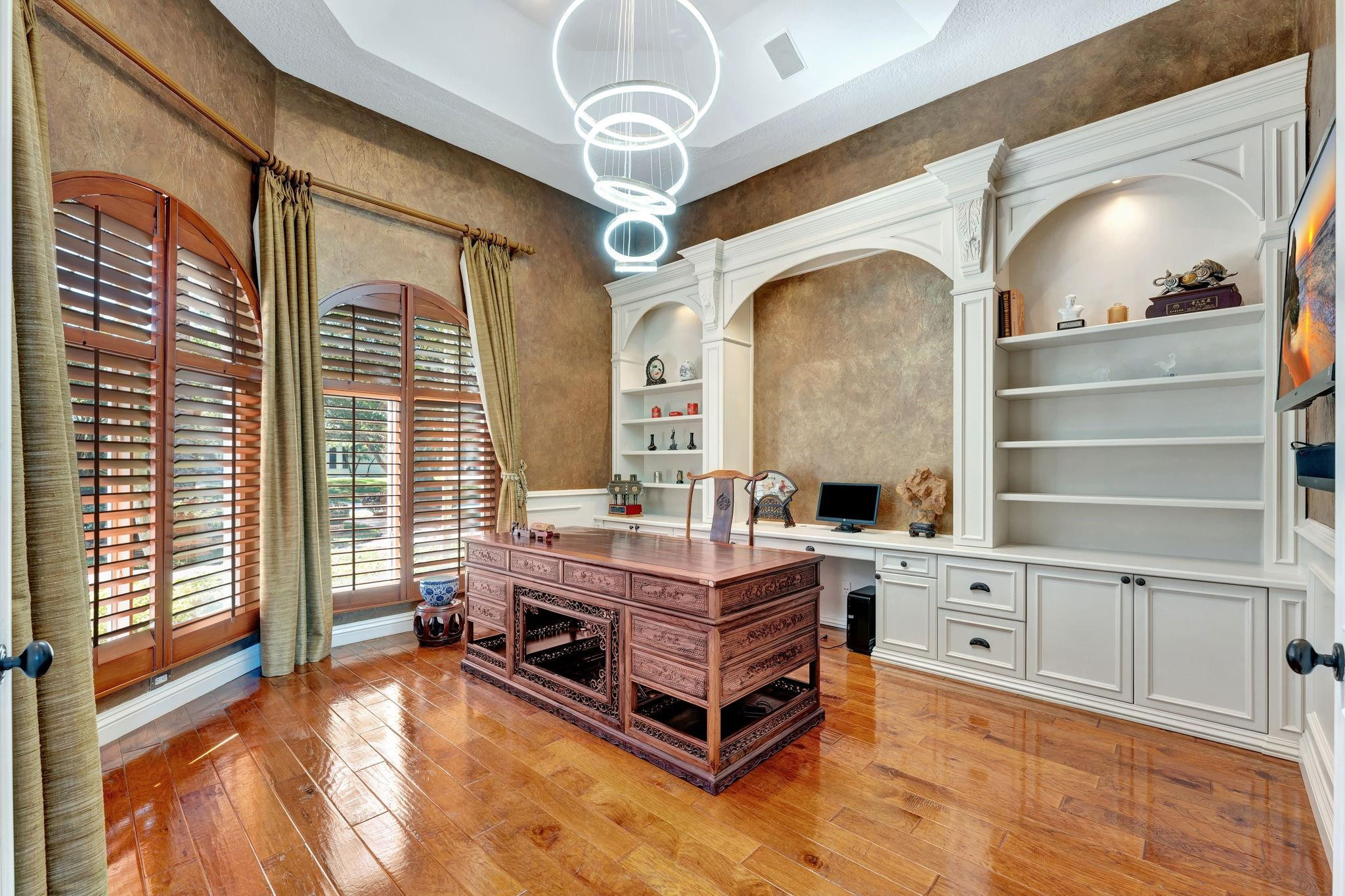 3460 Windmill Ranch Road Weston, FL 33331 - Photo 55 of 75 a spacious bedroom with a bed and a chandelier