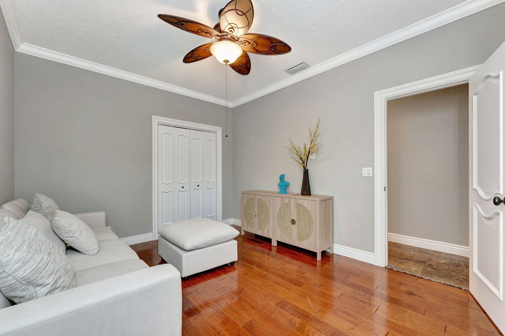 3460 Windmill Ranch Road Weston, FL 33331 - Photo 58 of 75 a living room with furniture and a wooden floor