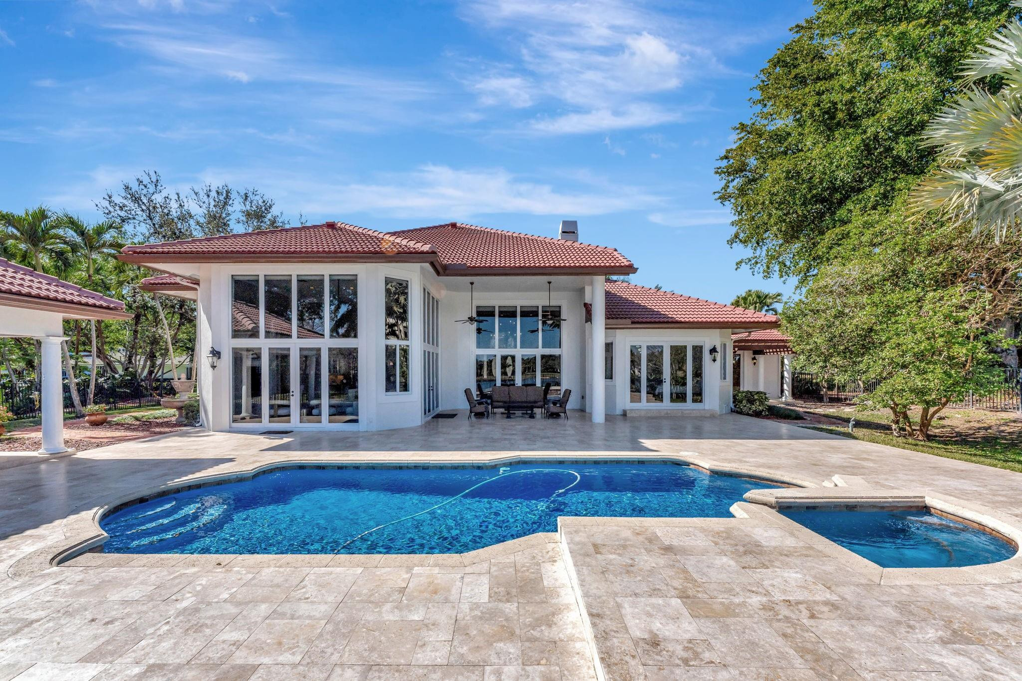 3460 Windmill Ranch Road Weston, FL 33331 - Photo 66 of 75 a front view of a house with yard and green space