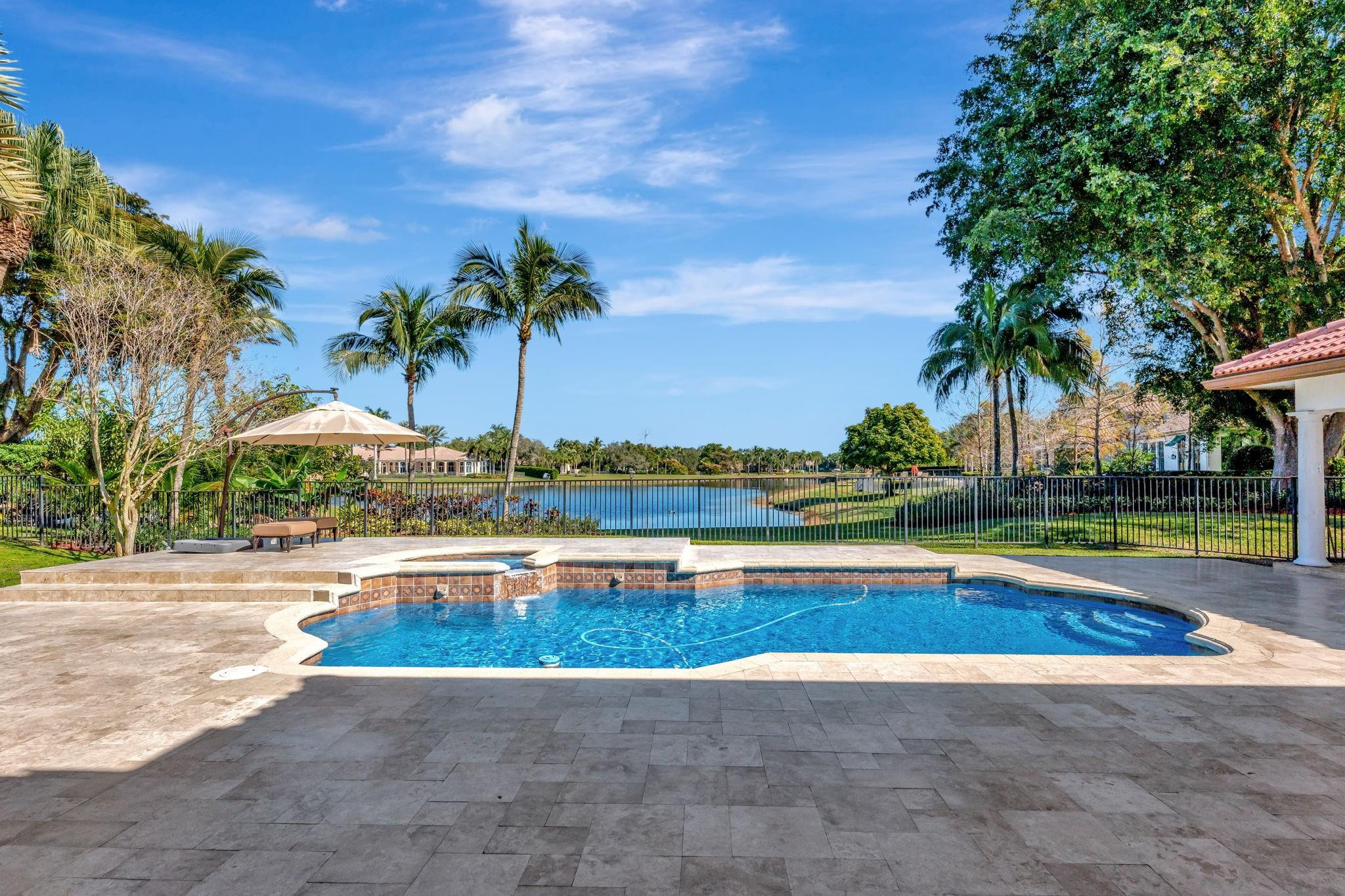 3460 Windmill Ranch Road Weston, FL 33331 - Photo 67 of 75 a view of swimming pool with outdoor seating and palm tree