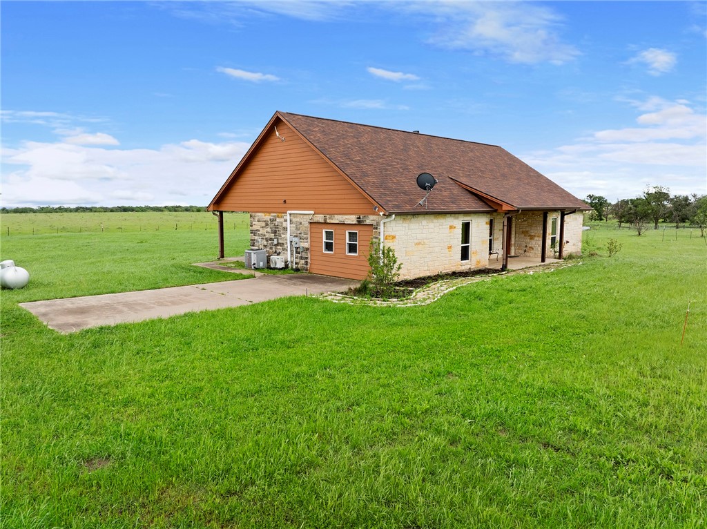 144 County Road 151 Riesel, TX 76682 - Photo 13 of 50 a front view of a house with yard and green space