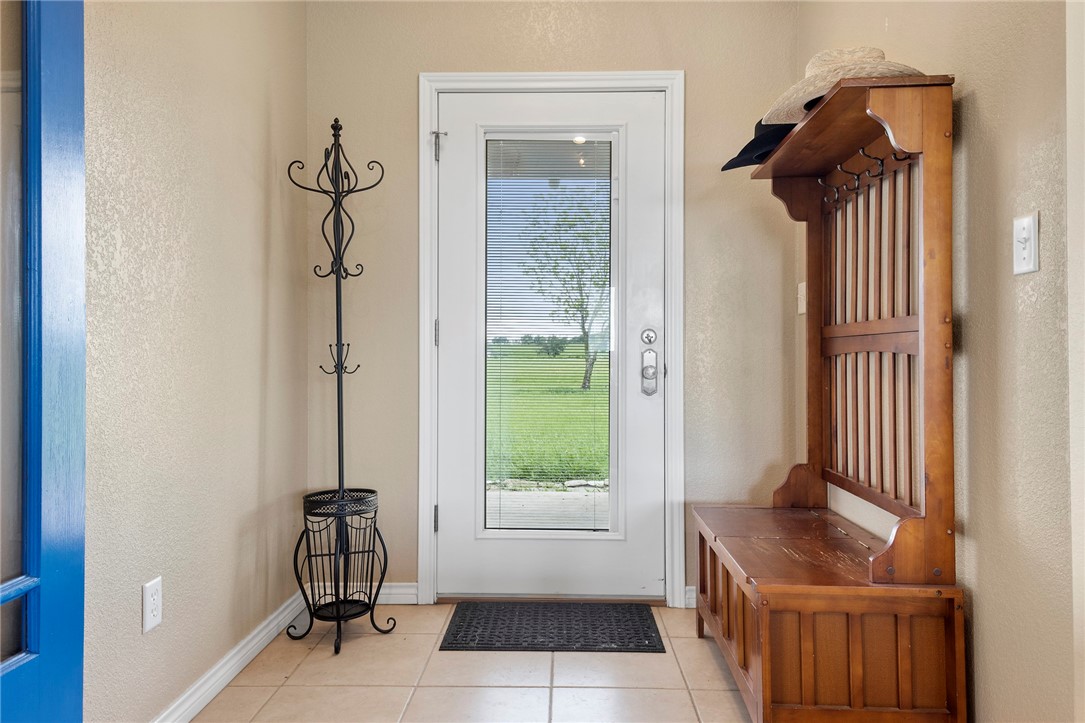 144 County Road 151 Riesel, TX 76682 - Photo 19 of 50 a view of a door and chair in a room