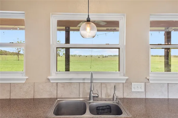 a kitchen with a sink and a window