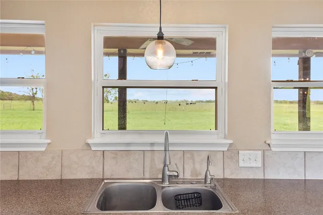 a kitchen with a sink and a window