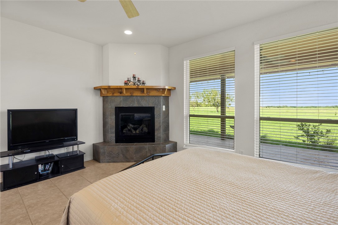 144 County Road 151 Riesel, TX 76682 - Photo 26 of 50 a bedroom with a bed and a flat screen tv