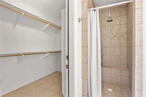 a bathroom with a glass shower door