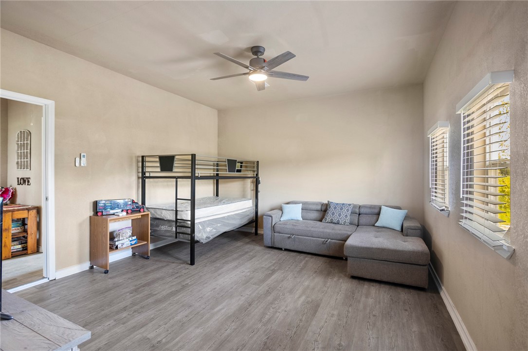 144 County Road 151 Riesel, TX 76682 - Photo 31 of 50 a living room with furniture and a wooden floor
