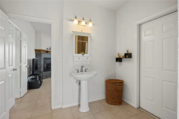 a room with a sink and storage