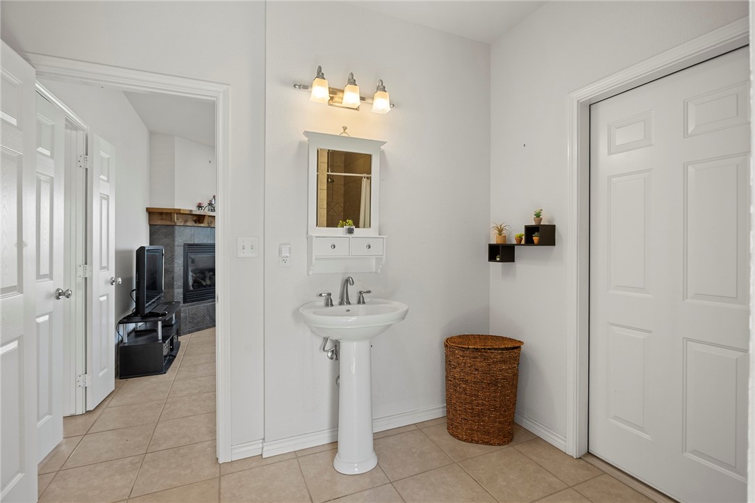 144 County Road 151 Riesel, TX 76682 - Photo 32 of 50 a room with a sink and storage