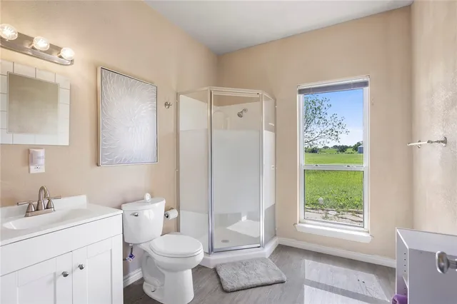 a bathroom with a toilet sink and a mirror
