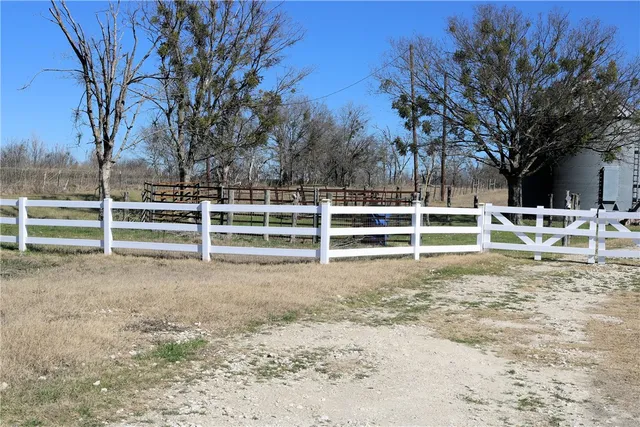 a view of outdoor space with wooden fence
