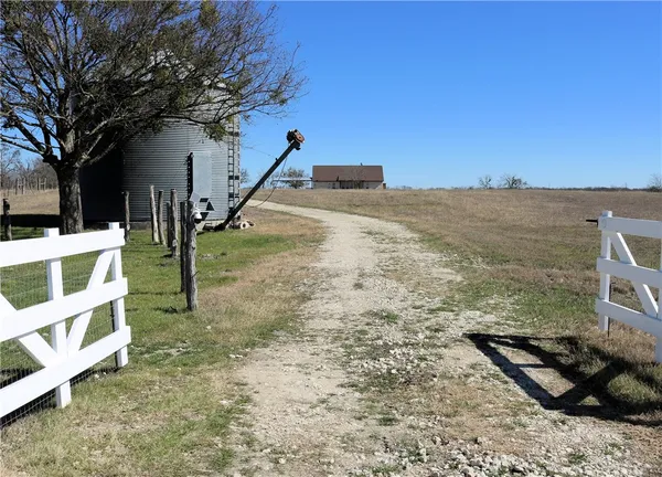a view of a road with a building in the background