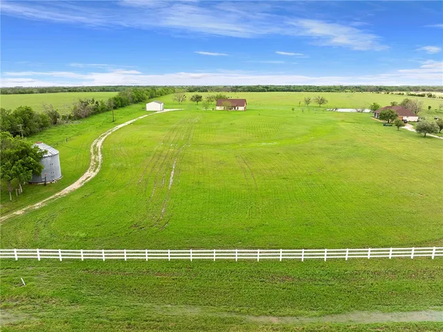 a view of an ocean and a yard