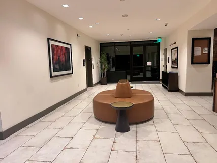 a lobby with furniture and window