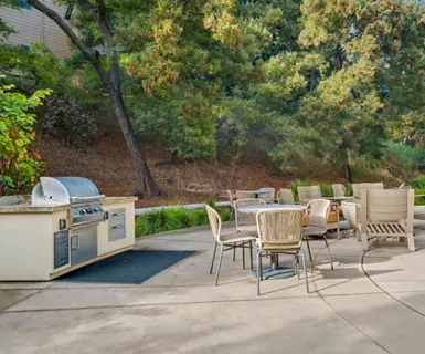 a view of a patio with a yard
