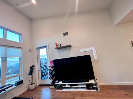 a room with wooden floor and gym equipment