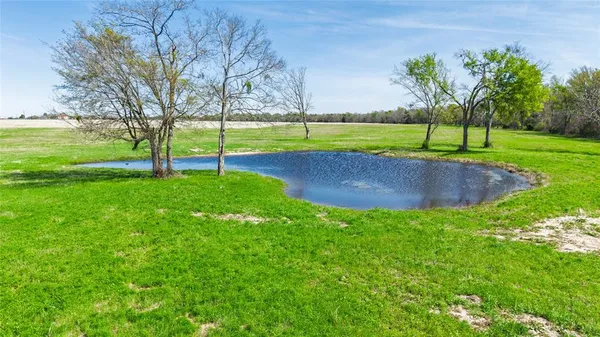 a view of a lake with a big yard