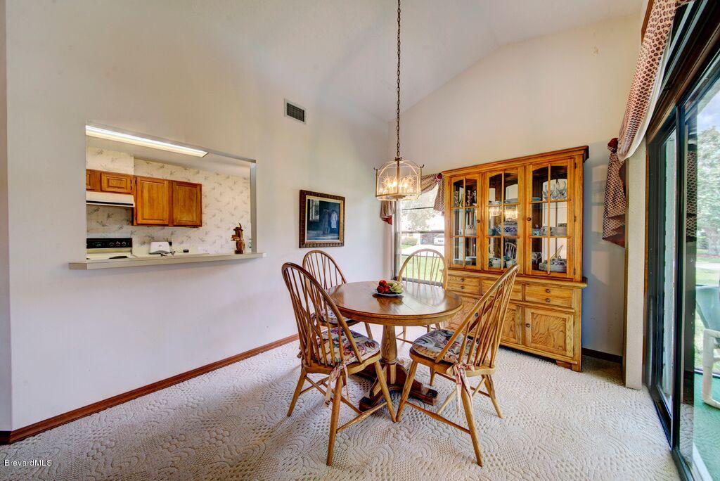 858 Ridge Lake Drive Melbourne, FL 32940 - Photo 9 of 25 Dining room with pass thru window