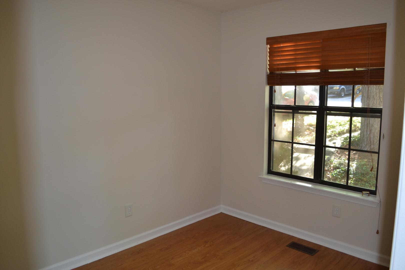 4018 The Oaks Drive Raleigh, NC 27606 - Photo 11 of 49 a view of an empty room with a window