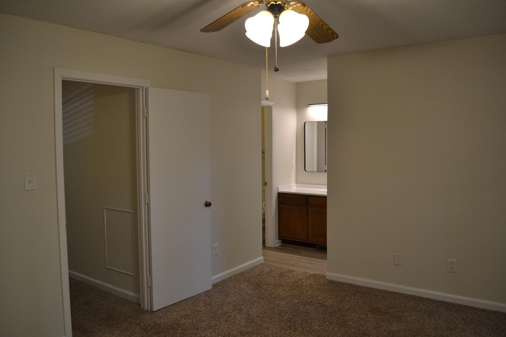 4018 The Oaks Drive Raleigh, NC 27606 - Photo 16 of 49 wooden floor in an empty room with a mirror