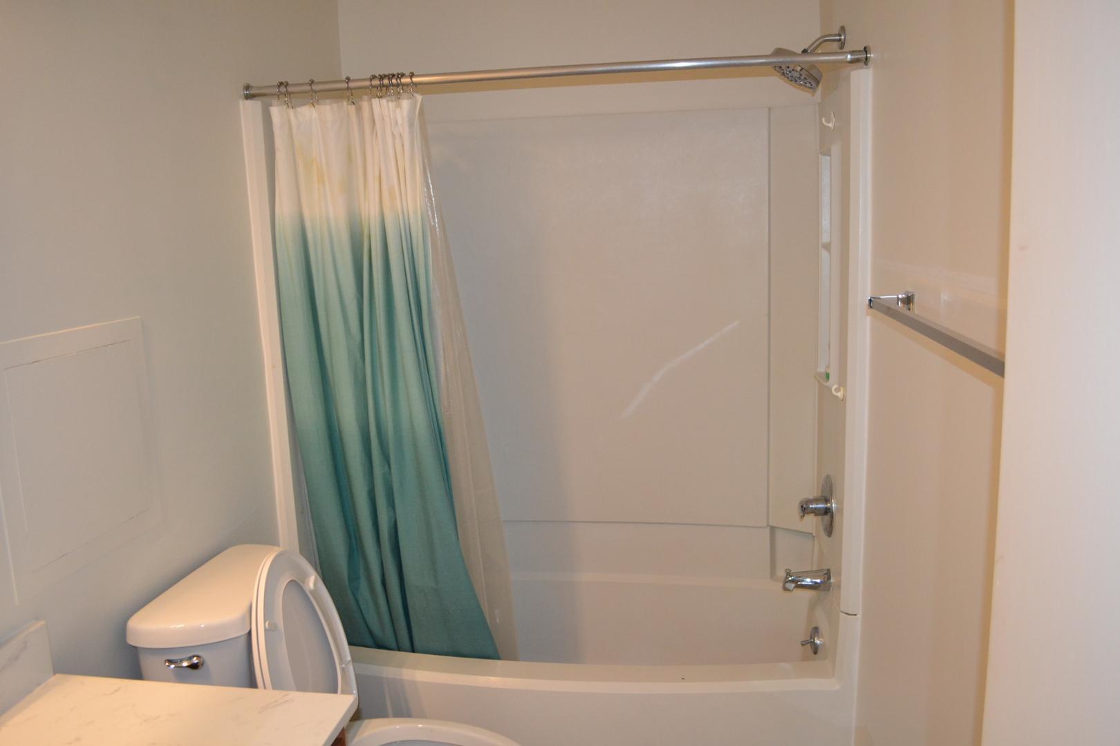 4018 The Oaks Drive Raleigh, NC 27606 - Photo 25 of 49 a bathroom with a shower and a toilet