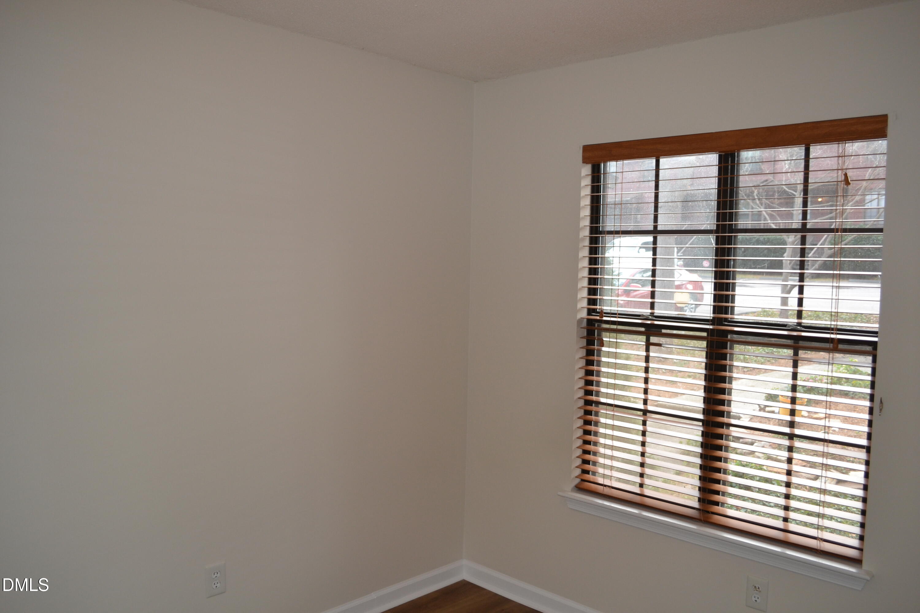 4018 The Oaks Drive Raleigh, NC 27606 - Photo 29 of 49 an empty room with windows