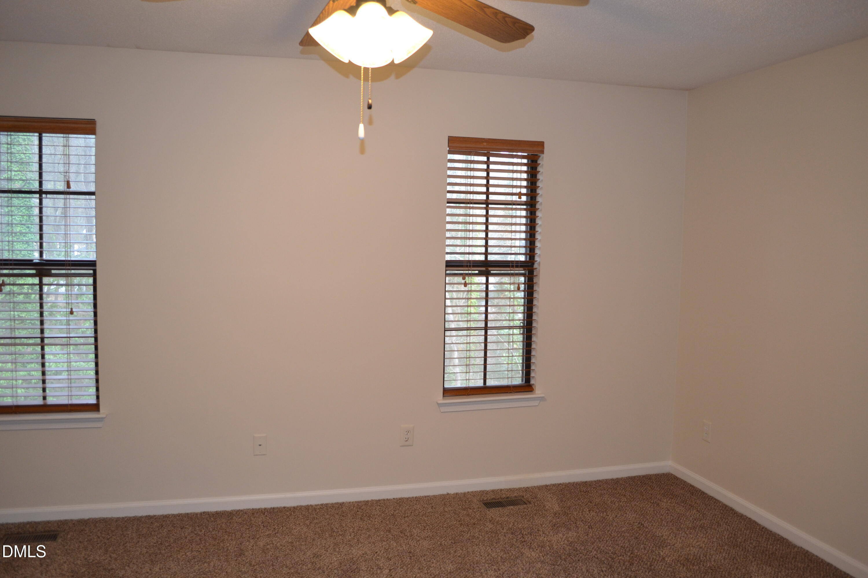 4018 The Oaks Drive Raleigh, NC 27606 - Photo 36 of 49 an empty room with windows