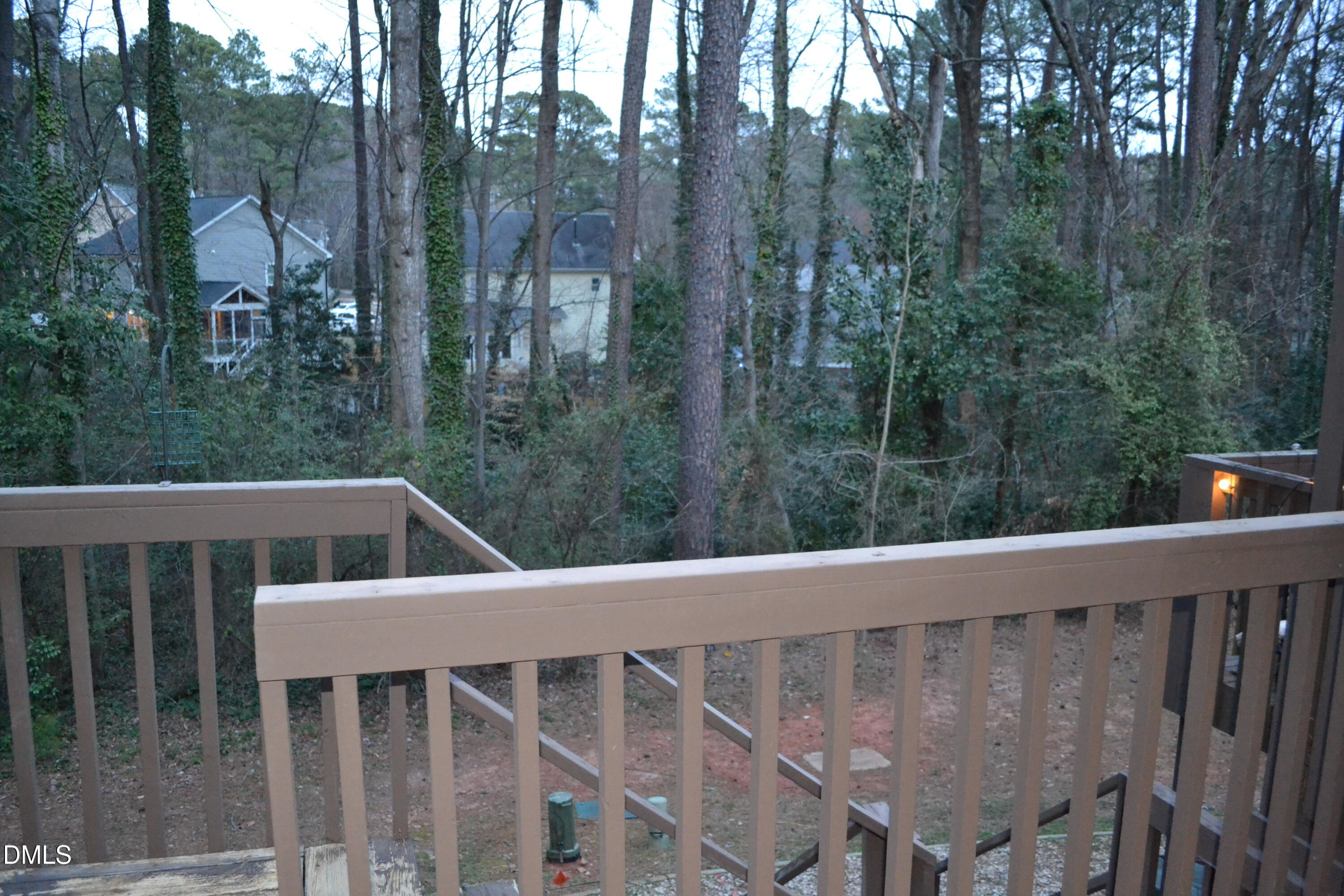 4018 The Oaks Drive Raleigh, NC 27606 - Photo 46 of 49 a view of a wooden deck and backyard