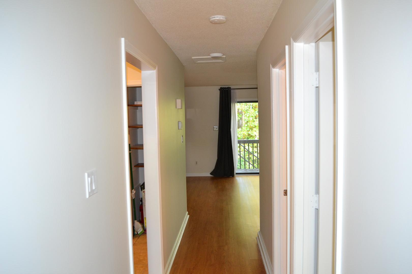 4018 The Oaks Drive Raleigh, NC 27606 - Photo 8 of 49 a view of hallway with livingroom and wooden floor