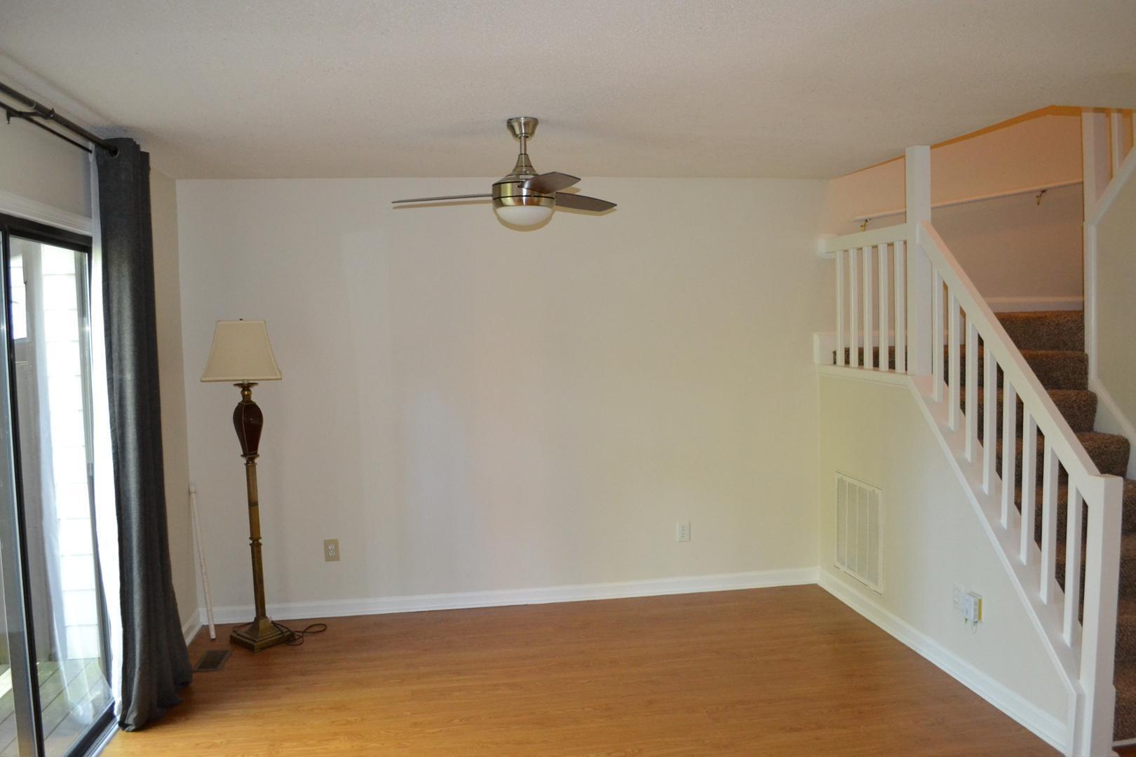 4018 The Oaks Drive Raleigh, NC 27606 - Photo 10 of 49 a view of an empty room with stairs