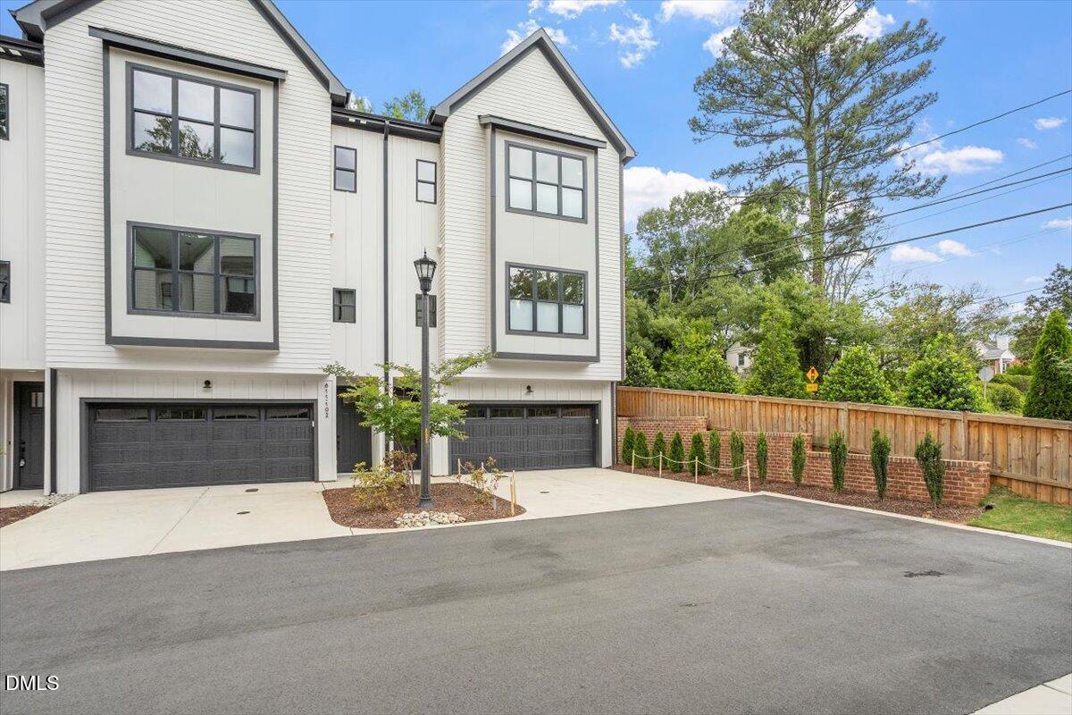 811 Maple Berry Lane, Unit 101 Raleigh, NC 27607 - Photo 3 of 45 a front view of a house with yard